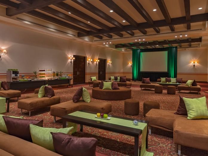 Arco Ballroom comfy seating arrangements with warm lighting at Hacienda del Mar Los Cabos