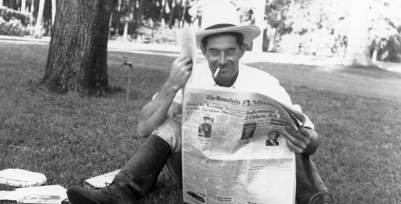 Man reading newspaper