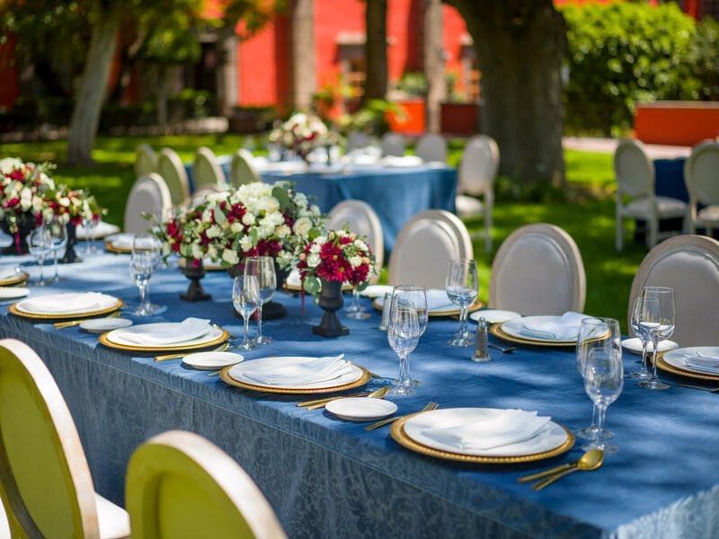 Tables set up in rose garden at FA Hacienda Galindo