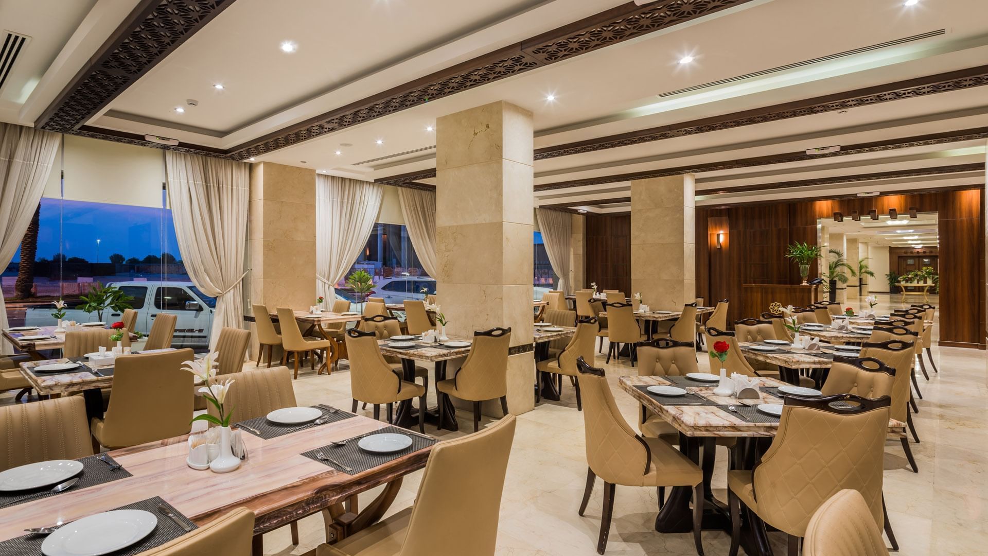 Dining area with set-up tables in Royal restaurant at Warwick Hotels & Resorts