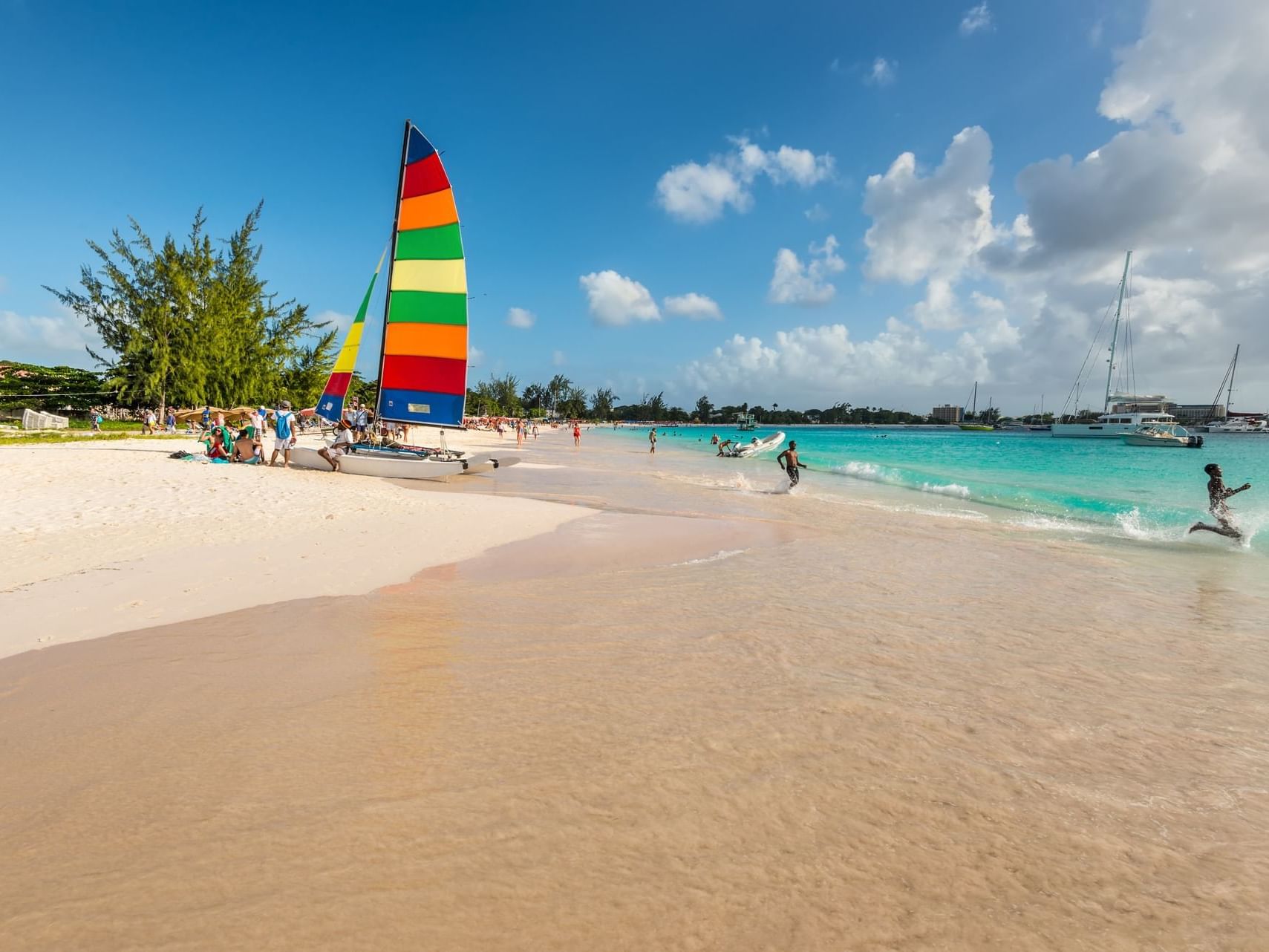 People relaxing on the Carlisle bay beach near Southern Palms