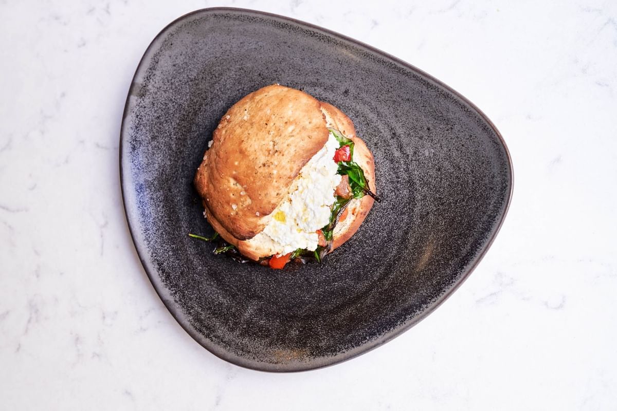 High-angle shot of a Lachs-burger served at Flemings Hotels