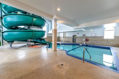 Slide next to the pool area in Waterpark at Service Plus Inns & Suites