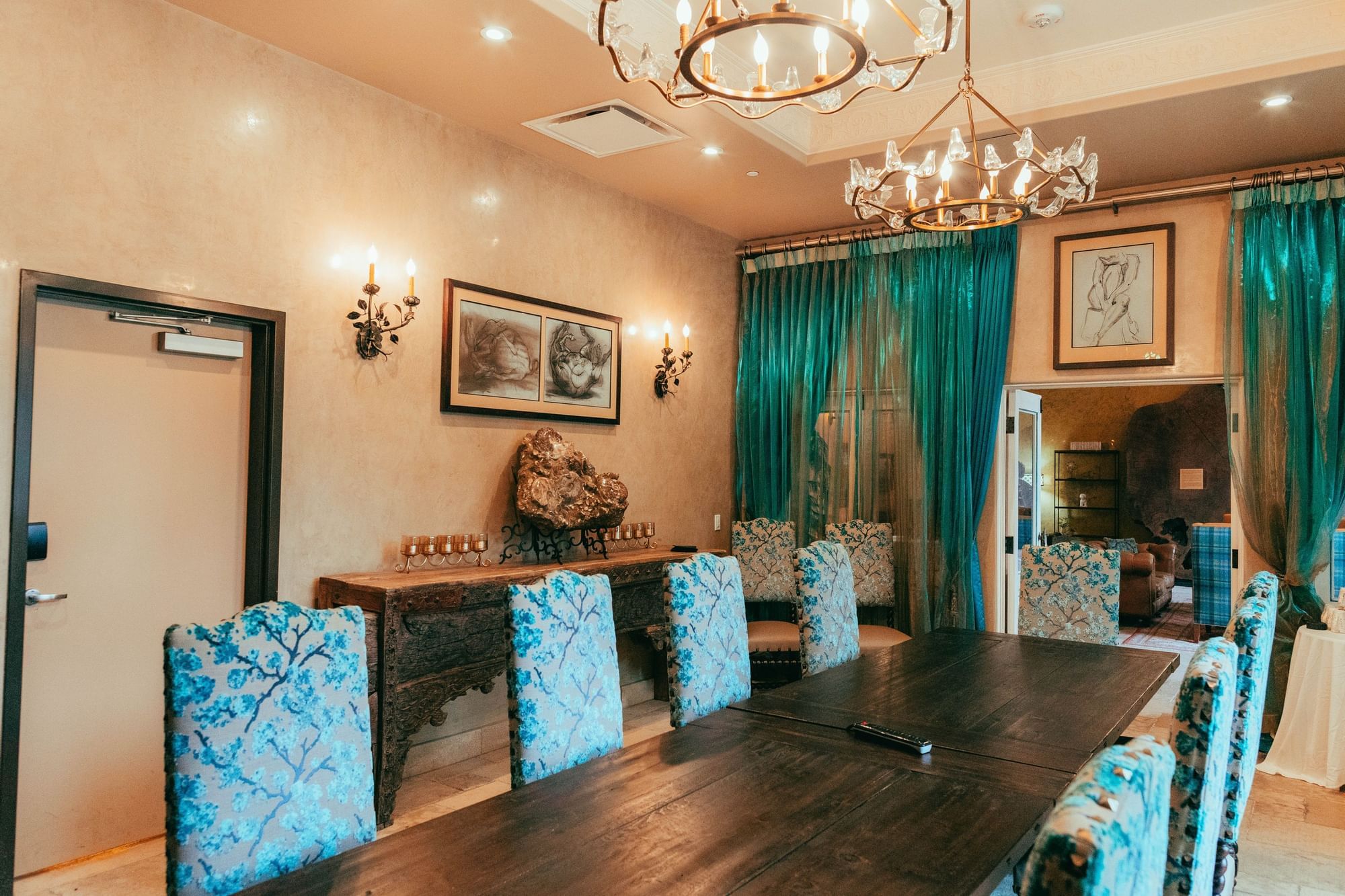 Lorem ipsum Boardroom with teal chairs, dark wood table and teal curtains