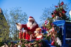 Santa Claus sitting on a float during the Very Merry Christmas Parade at Disney's Magic Kingdom.