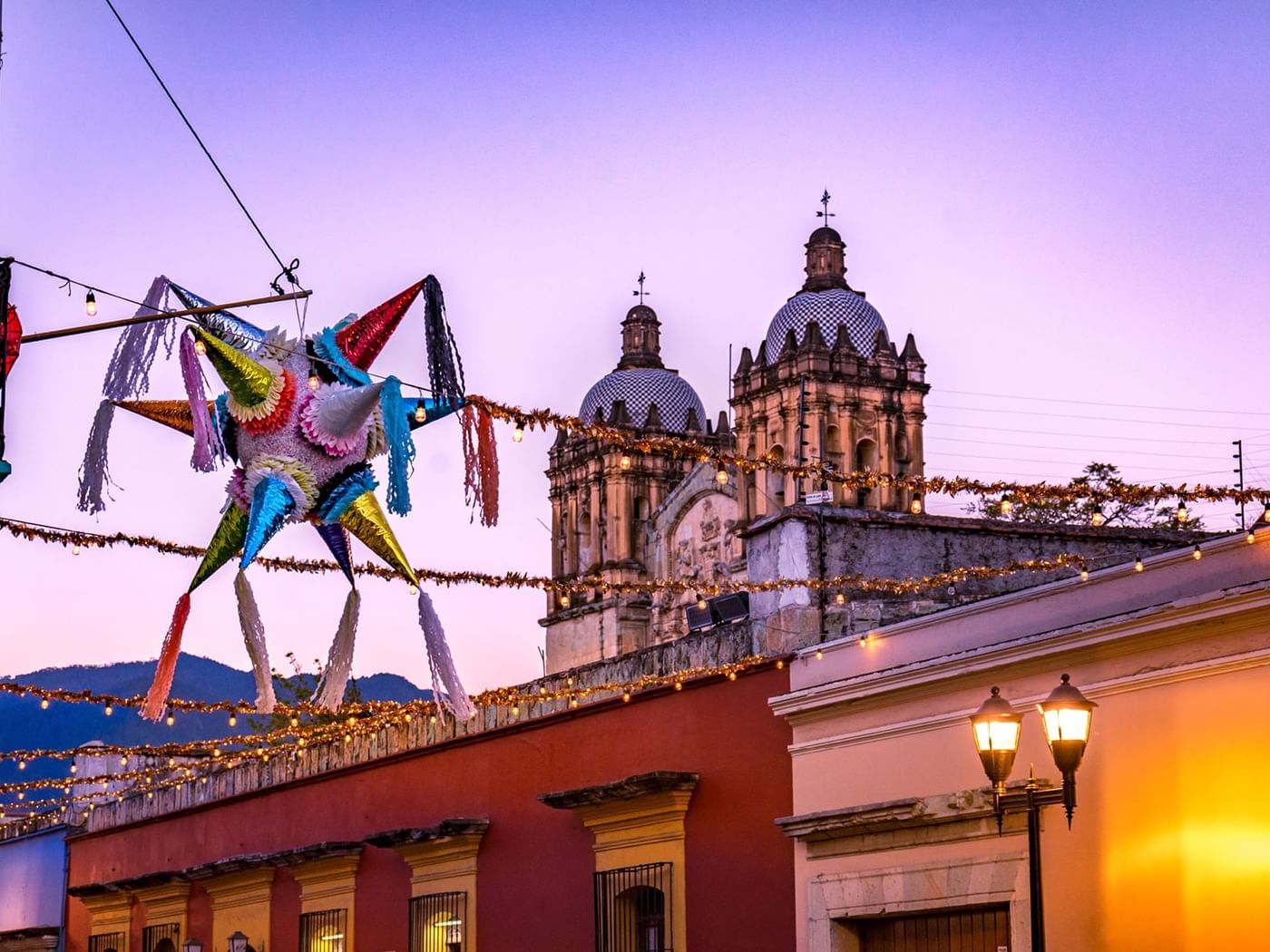 Colorful Pinata traditional fiesta decoration & festive lights over the streets in Atlixco near Gamma Hotels