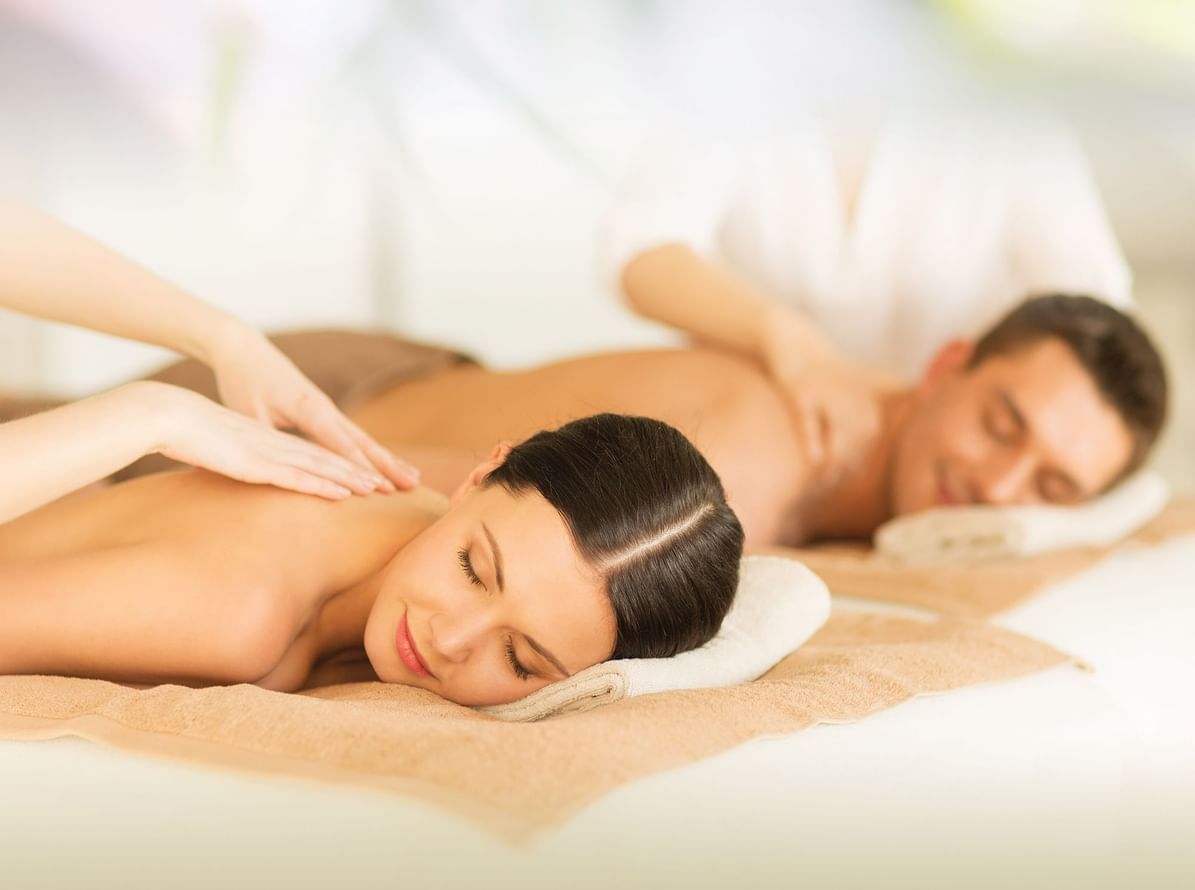 A couple receiving a massage at the Spa in the hotel