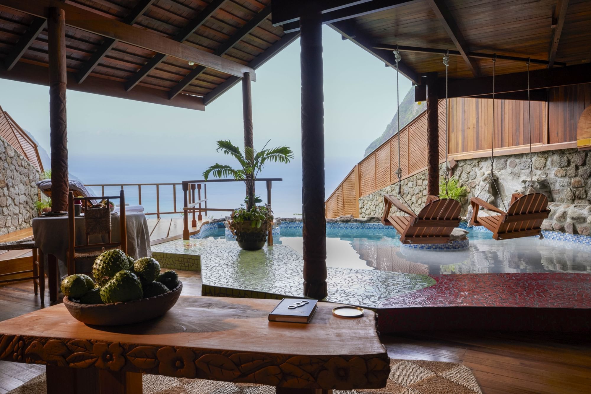 An open-air living room with a heated pool in Heritage Suites, hotel accommodation in St Lucia