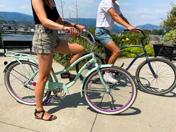 A couple riding bicycles near Manteo Resort