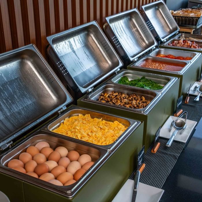 Buffet Breakfast setup with various breakfast dishes in serving chafers at Mercure Kooindah Waters