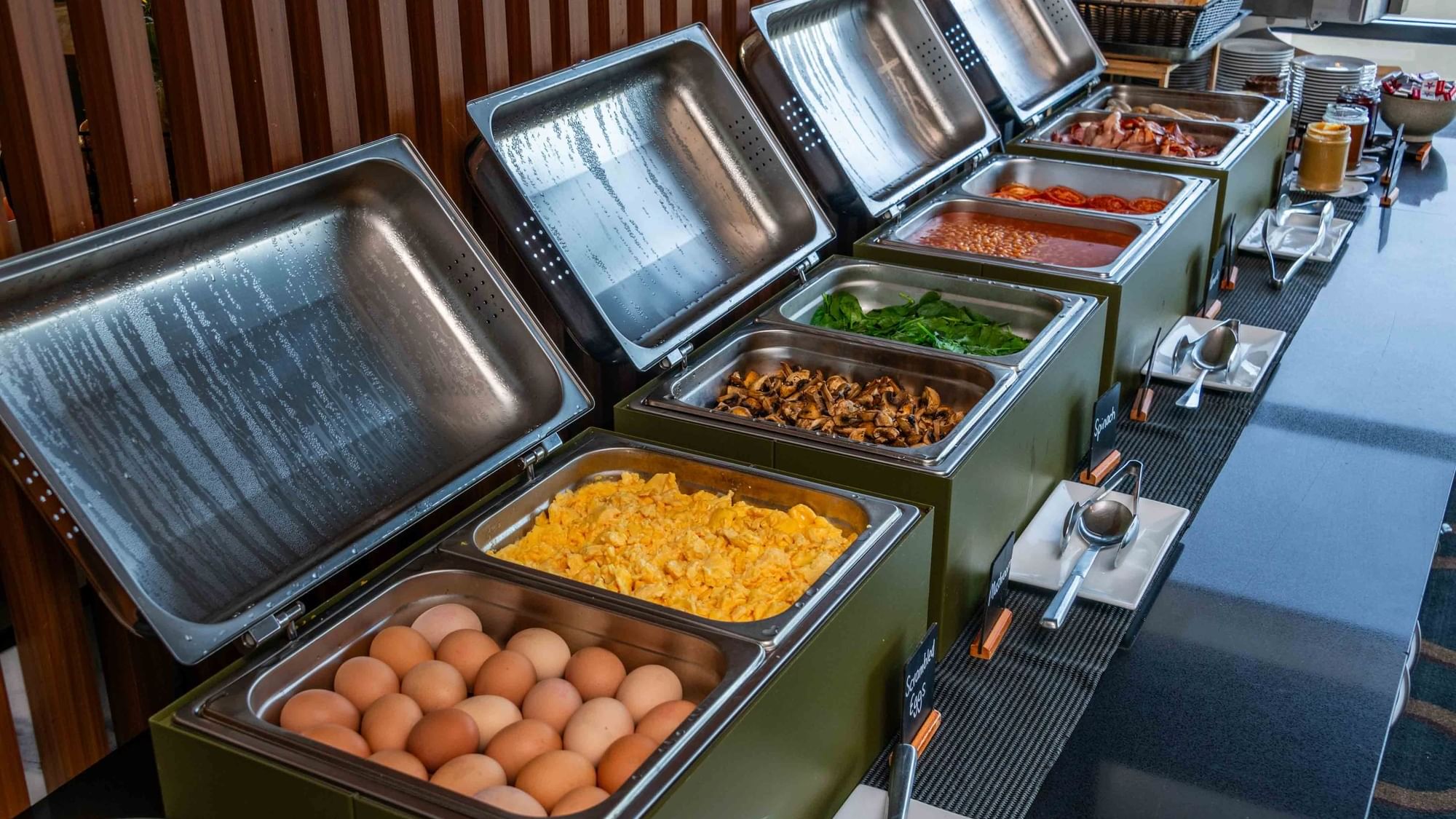 Buffet Breakfast setup with various breakfast dishes in serving chafers at Mercure Kooindah Waters