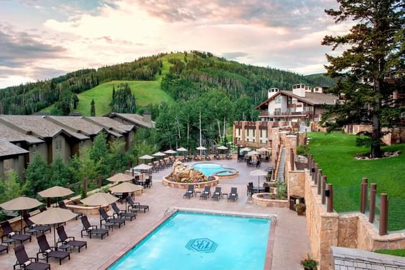 Landscape view of the pool with lounges at Stein Eriksen Lodge