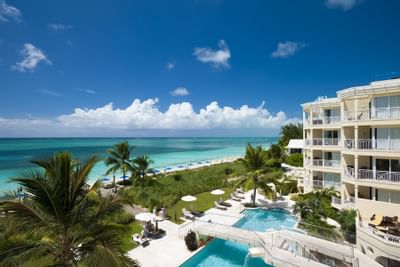 View of the Beachfront pool and ocean at Windsong Resort On The Reef