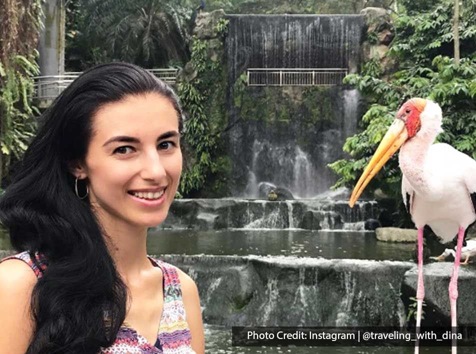 Girl posing by a Stork in KL Bird Park, a cool attraction spot near Imperial Lexis Kuala Lumpur