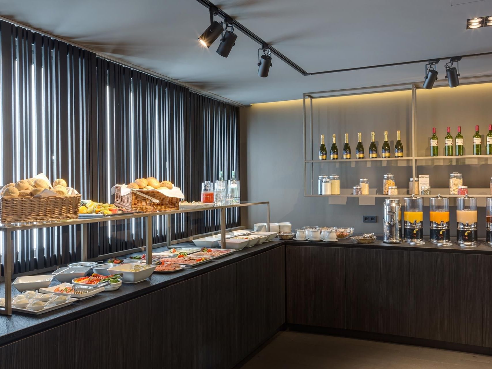 Freshly baked bread, fruits, and hot dishes at the breakfast buffet of Hotel Sylter Hof Berlin