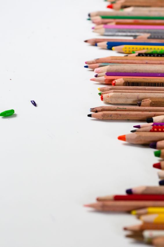 A set of color pencils on a white surface, The Rockaway Hotel