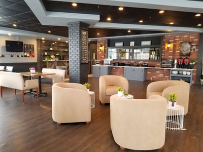 Bucket Arm Chairs arranged in Breakfast Room at Fort McMurray Hotels