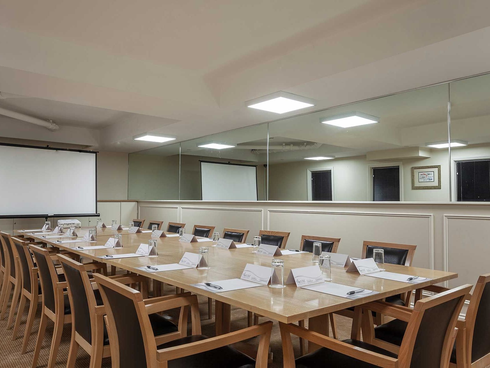 The Boardroom with a projector at Orsett Hall Hotel