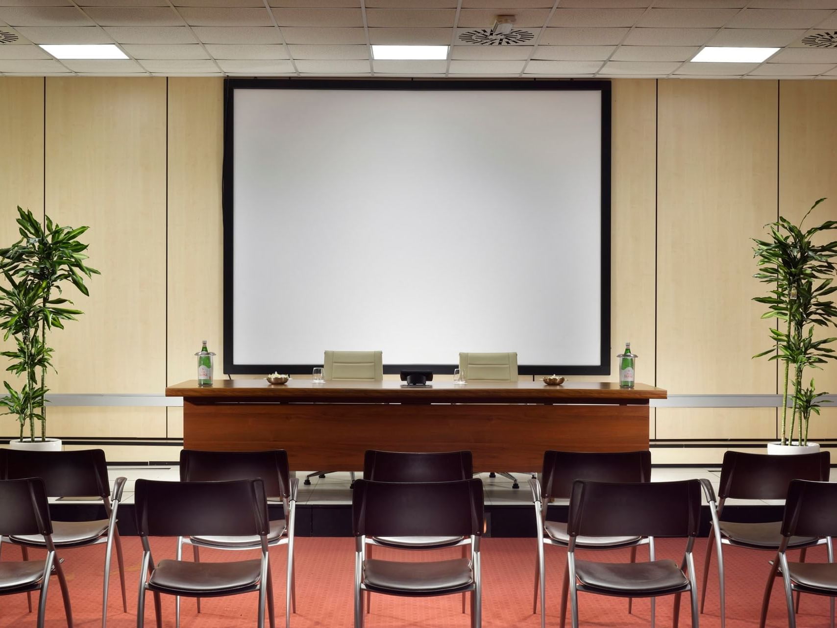 Chairs arranged in the Green Meeting Room at Golf Hotel Punta Ala