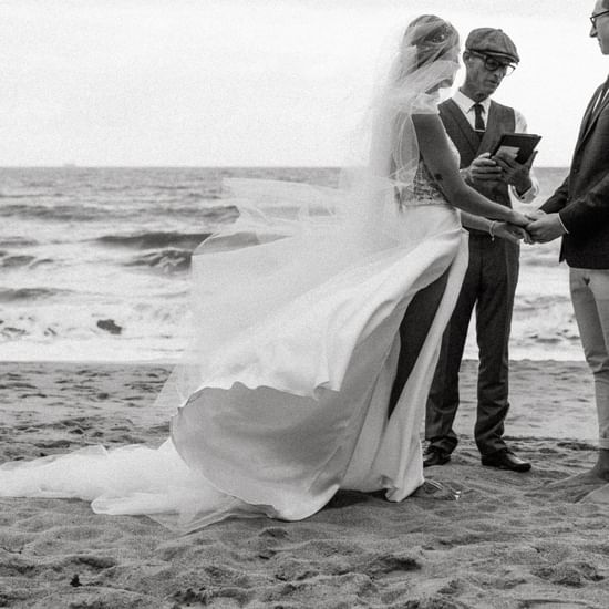 Wedding couple with a man near Pullman Palm Cove Sea Resort