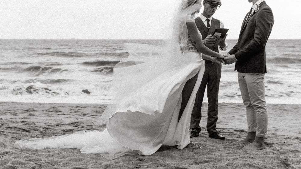 Wedding couple with a man near Pullman Palm Cove Sea Resort