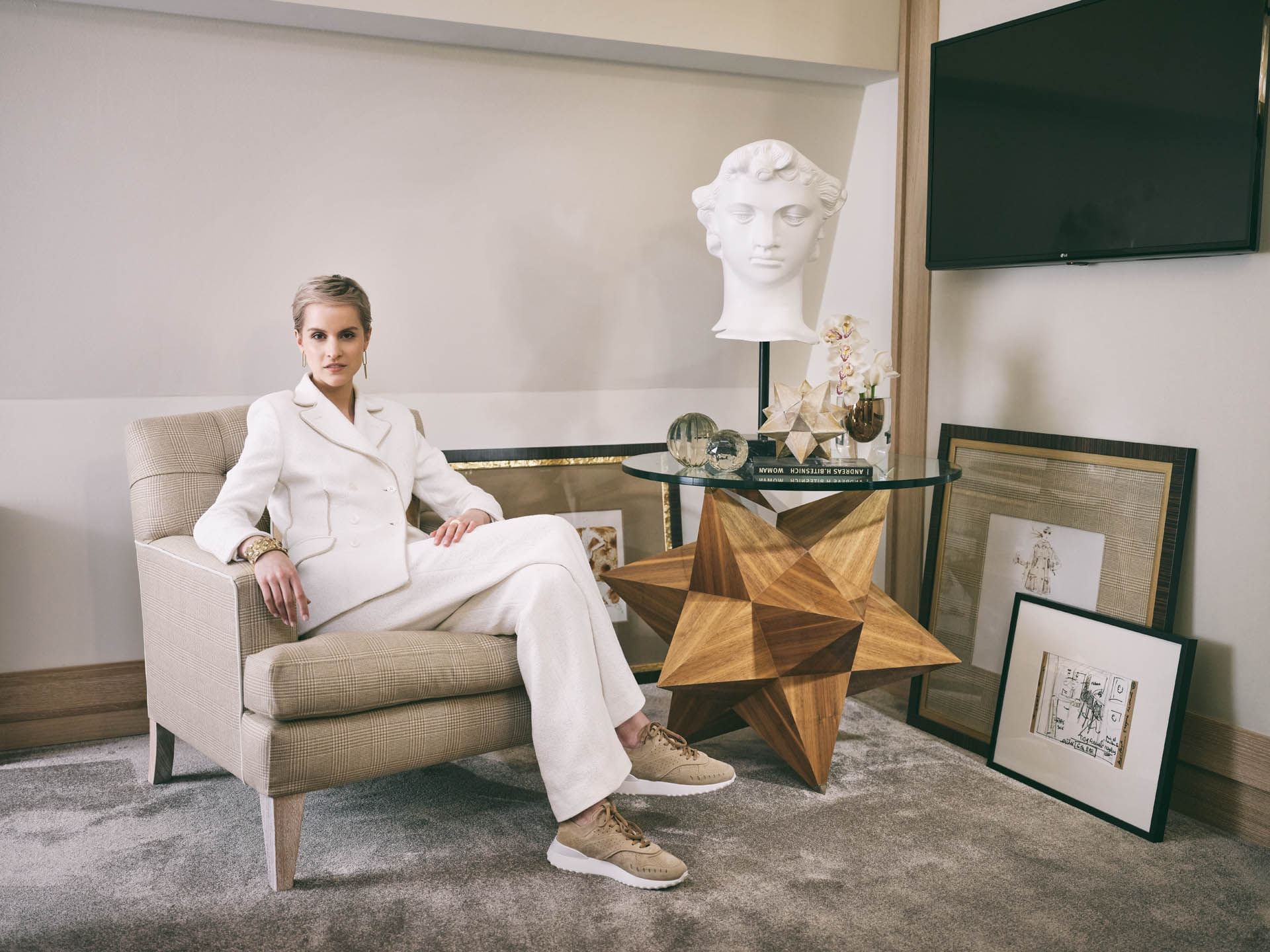 Model posing in the lobby at Patrick Hellman Schlosshotel