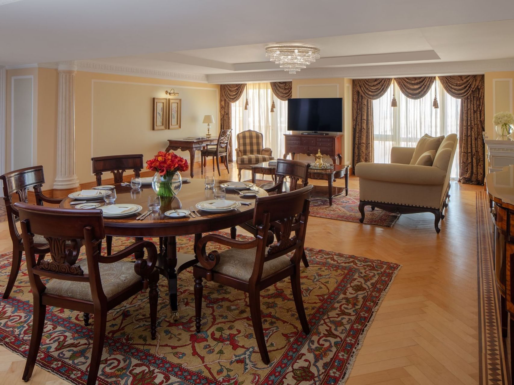 Dining table with 5 chairs in Kabbar Suite at The Regency Hotel