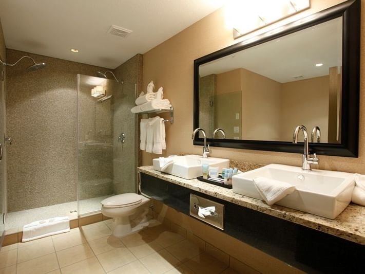 sinks, toilet, and shower in a bathroom