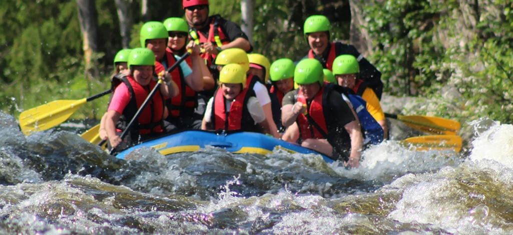 A group of people on a Canmore raft tour.