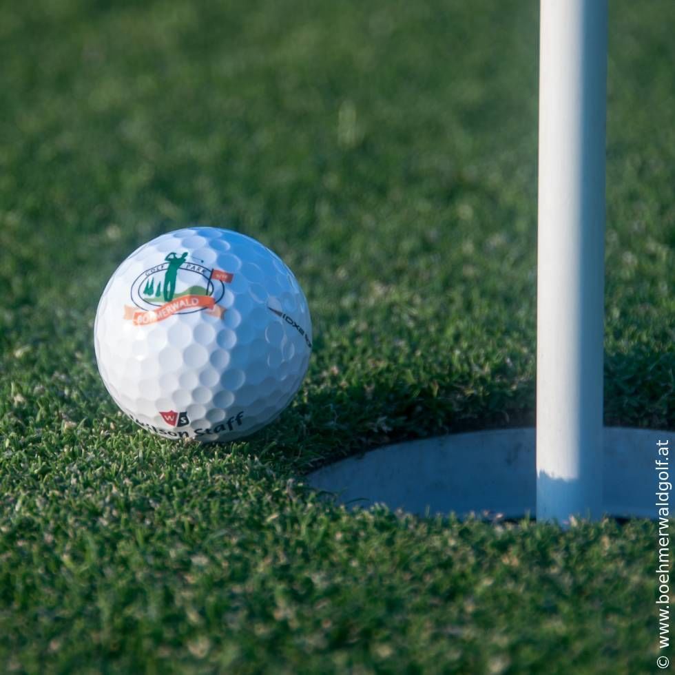 A golf ball by the hole near Falkensteiner Hotels