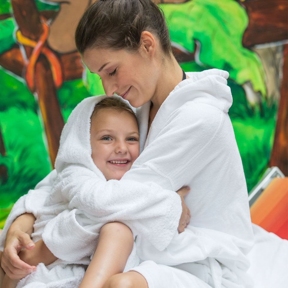 Mom & daughter in bathrobes at Falkensteiner Hotels