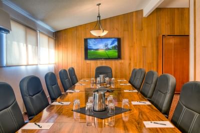 A large conference table arranged in Boardroom at Fairmont Hot Springs Resort