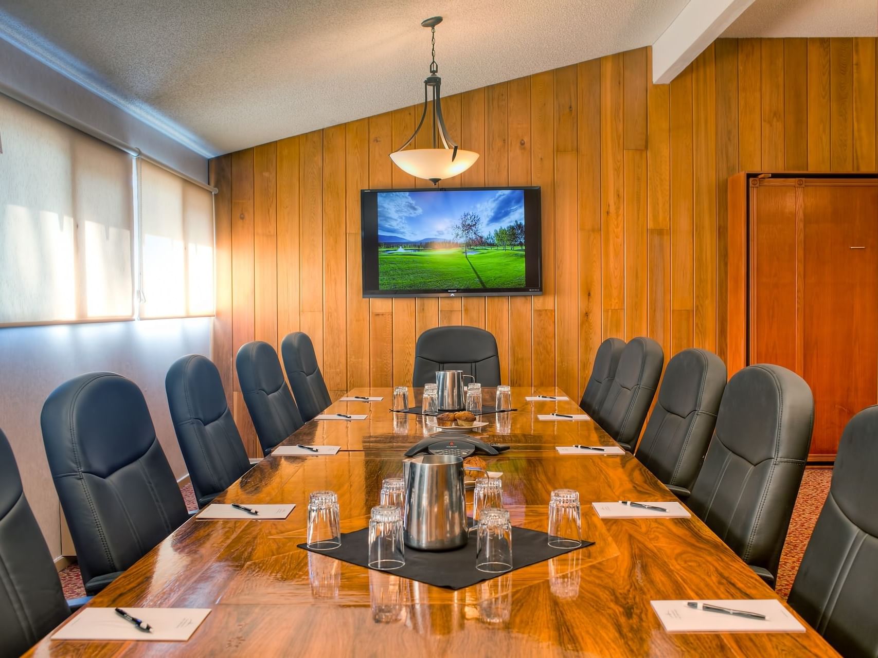 A large conference table arranged in Boardroom at Fairmont Hot Springs Resort