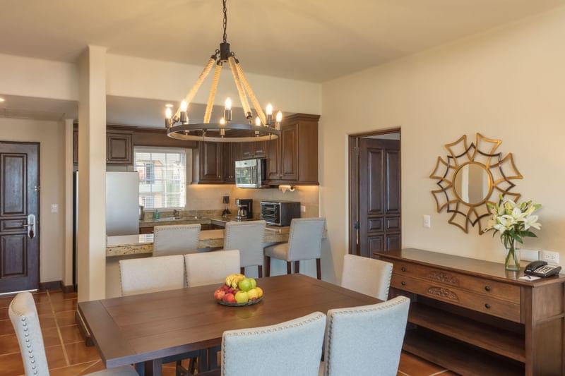 Open kitchen with island, stylish dining area, and modern décor.