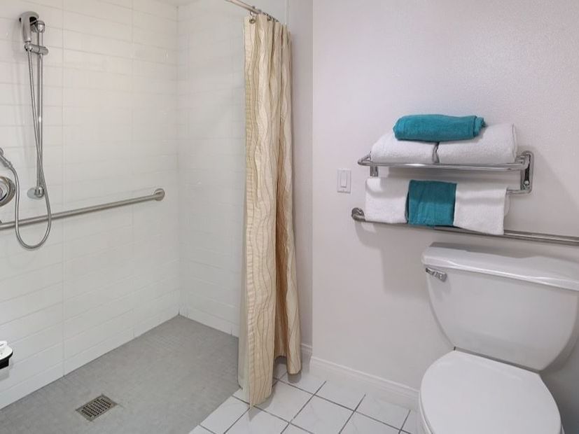Interior of a bathroom in Accessible Two Queen at Anaheim Hotel