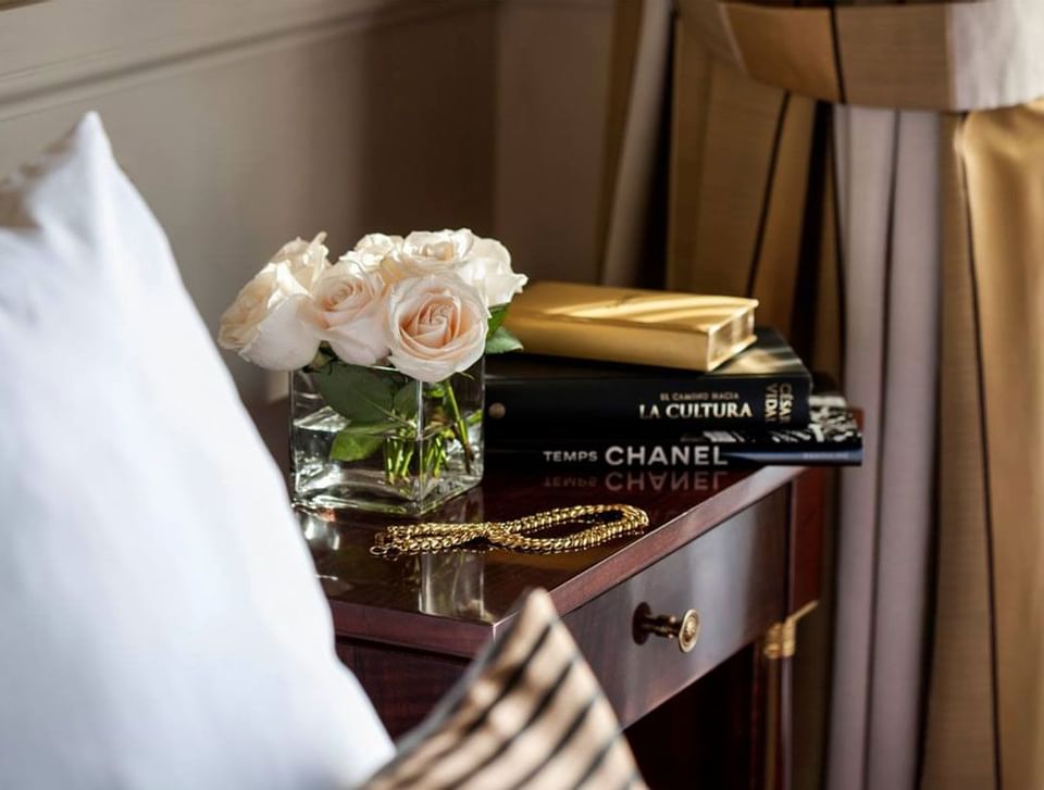 Roses & books on a nightstand at Hotel Emperador Buenos Aires