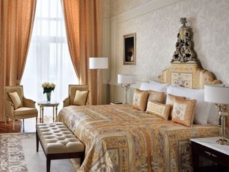 Bed, TV & accent chairs in Signature Suites at Palazzo Versace
