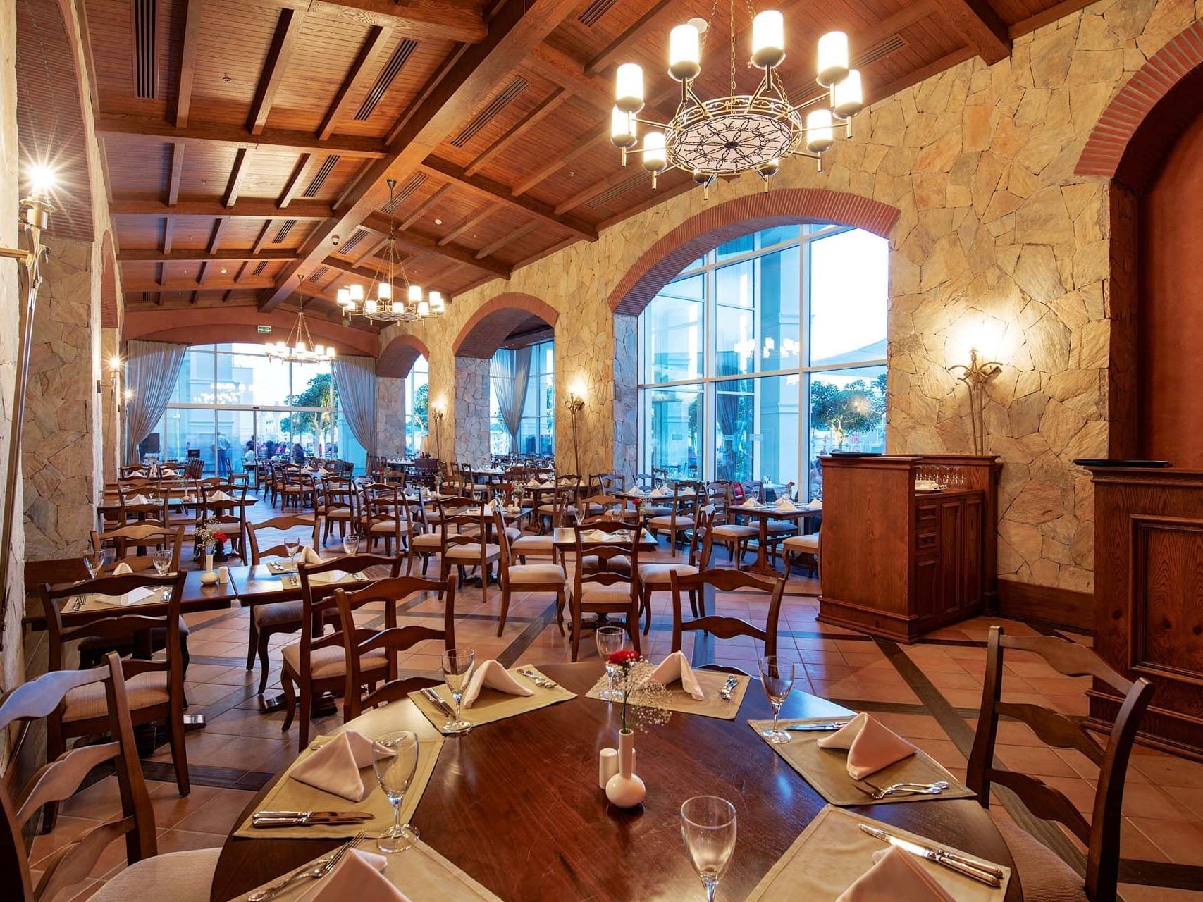 Dining table arrangements with outside view in Pascarella Italian Restaurant at Titanic Deluxe Golf Belek