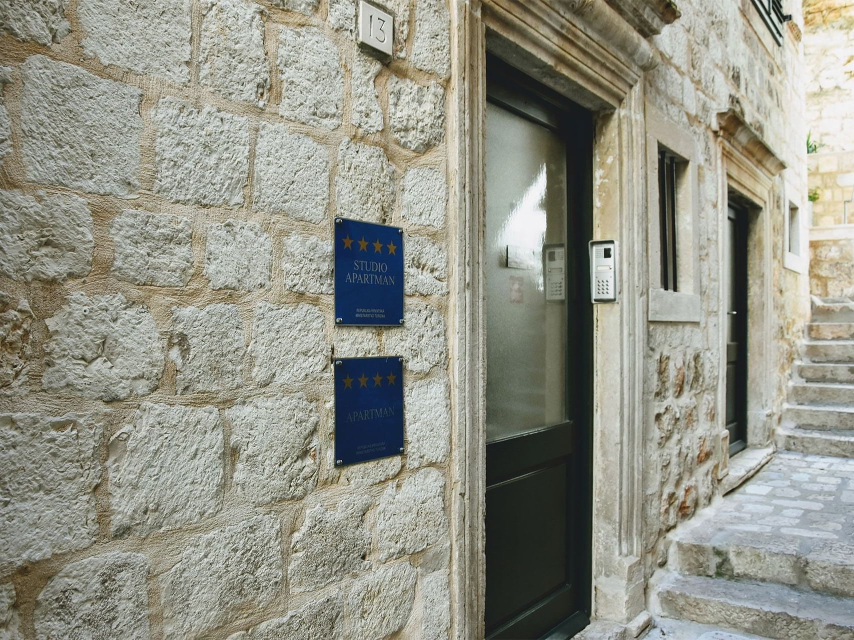 Exterior view of Celenga Apartments with stone walls