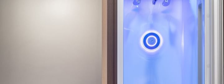 LG Styler steam closet with blue light in Superior Suite at Henn Na Hotel New York, a boutique hotel Midtown Manhattan