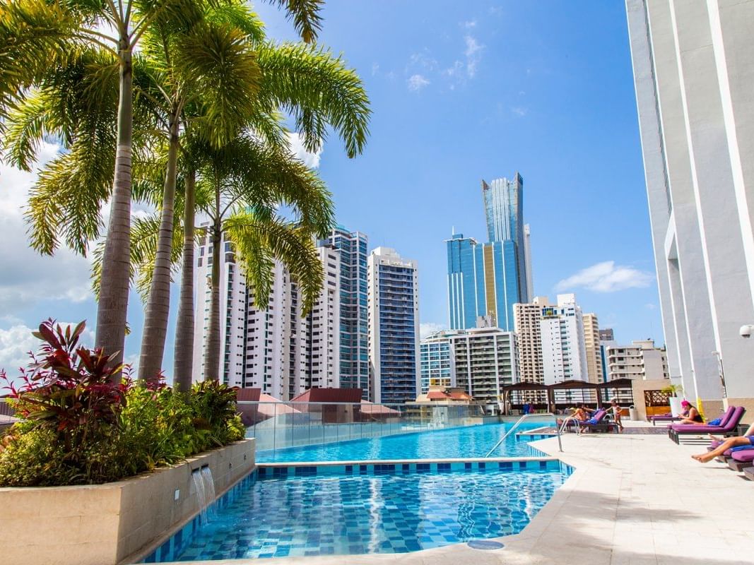 Outdoor pool area with sunbeds in Float Bar at Megapolis Hotel Panama