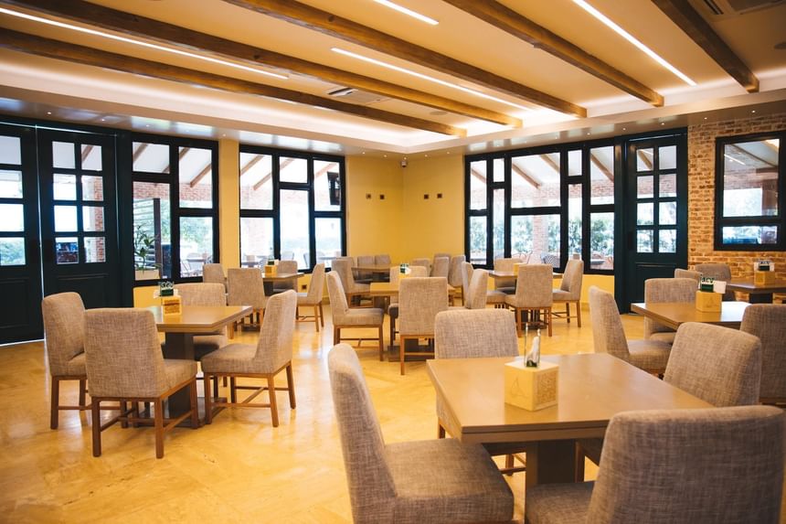 Elegant indoor dining table arrangement of Jaco Restaurant at Cha Cha Hotel