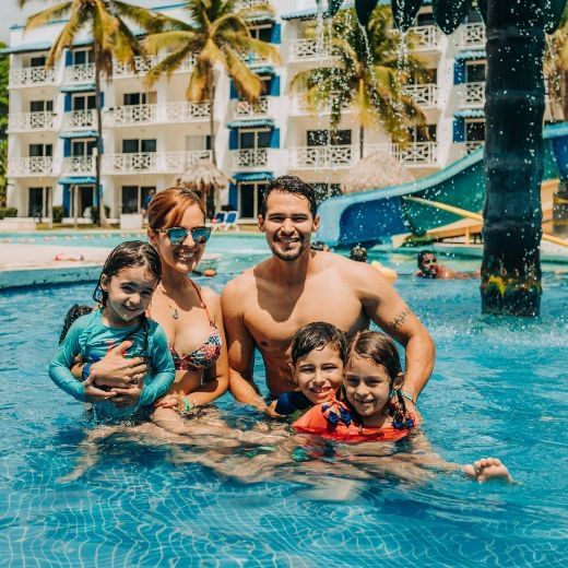 Family enjoying in the pool at Playa Blanca Beach Resort