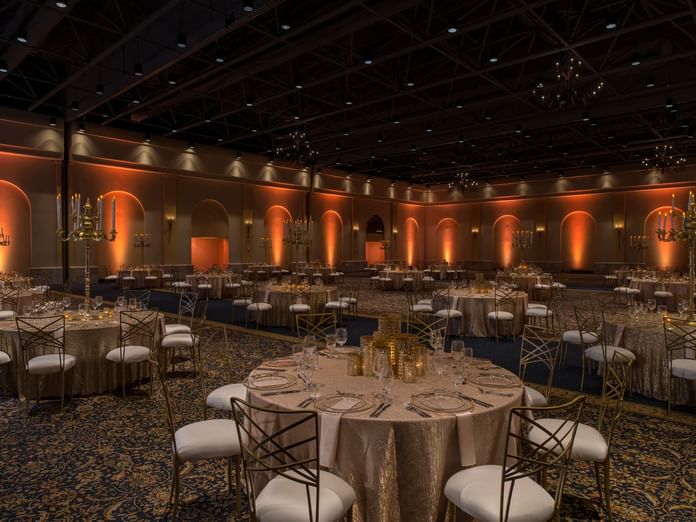 Arco Ballroom with beautiful dining arrangements and warm lighting at Hacienda del Mar Los Cabos