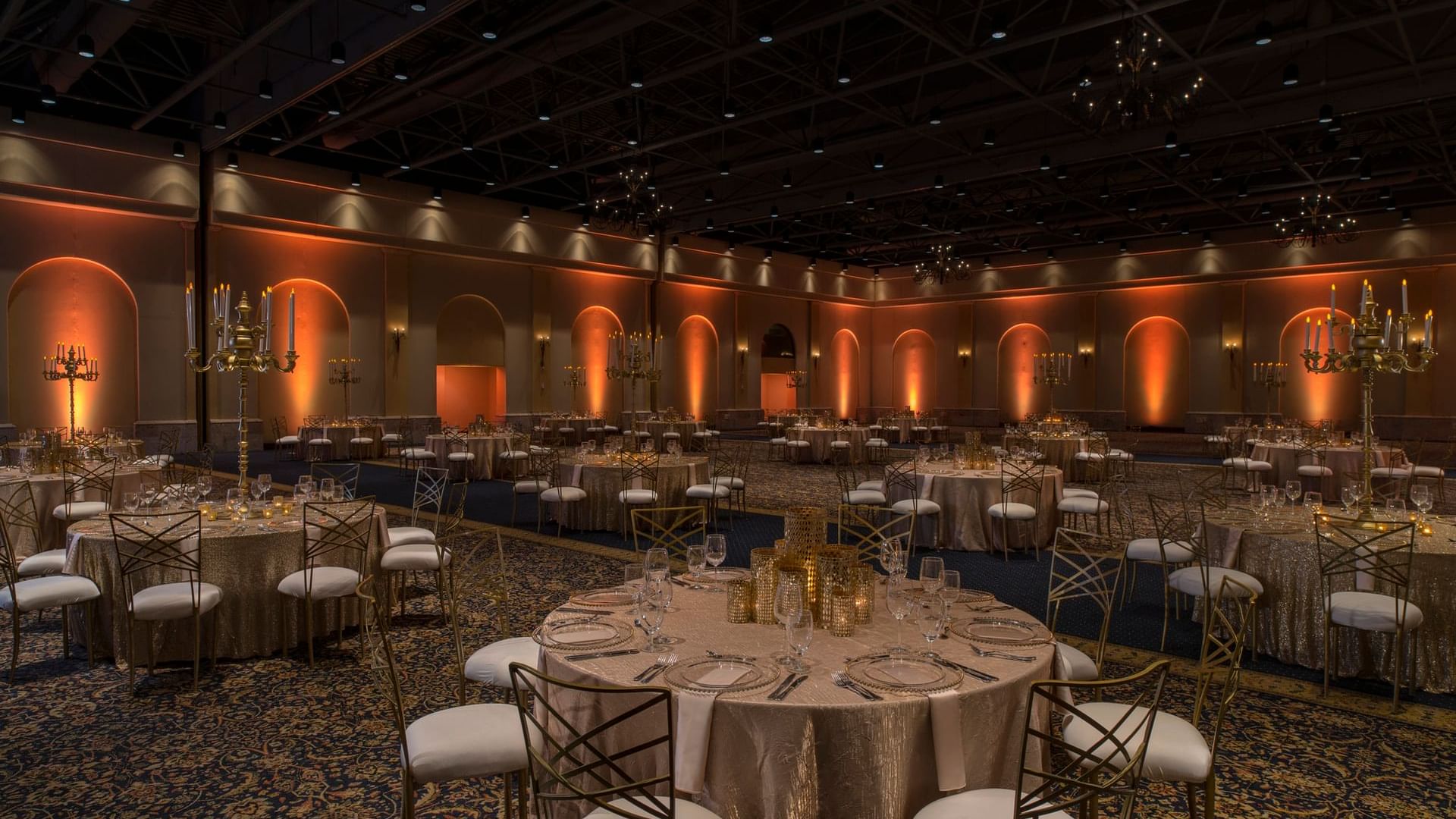 Arco Ballroom with beautiful dining arrangements and warm lighting at Hacienda del Mar Los Cabos