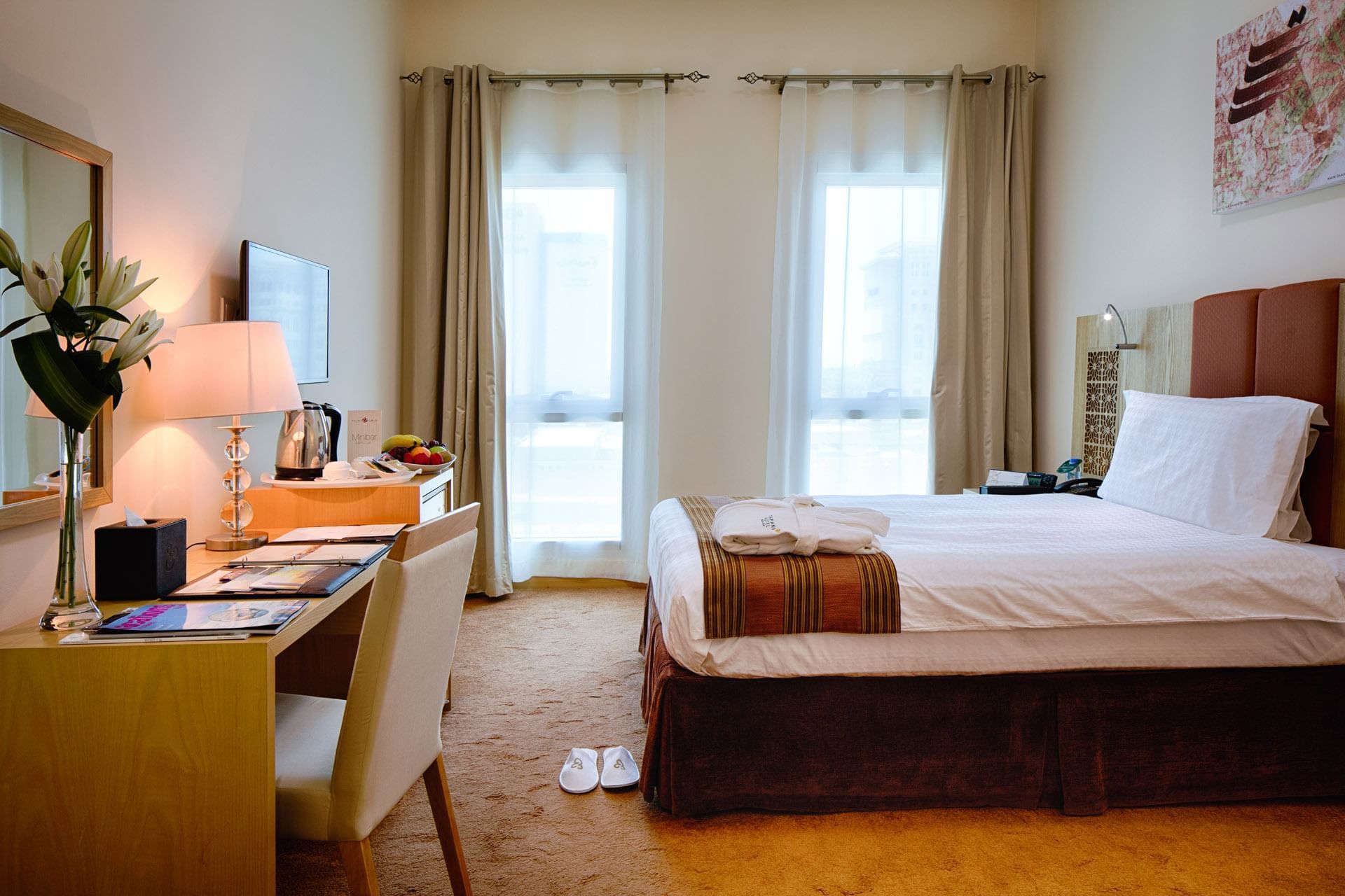 Interior of a singleroom with a bed at Tamani Marina Hotel