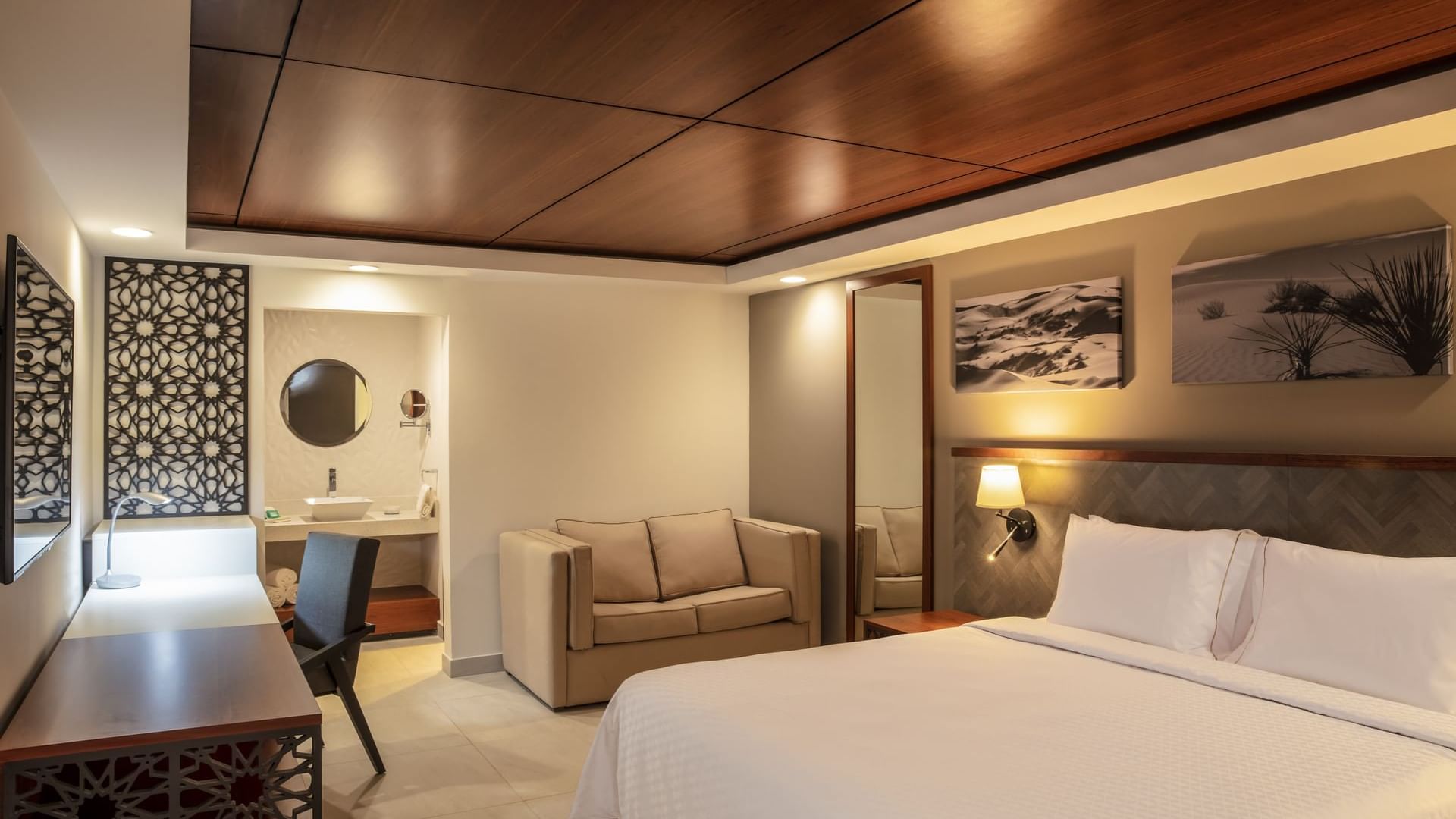 Beds, mirror, table & vanity at Gamma Ciudad Juarez