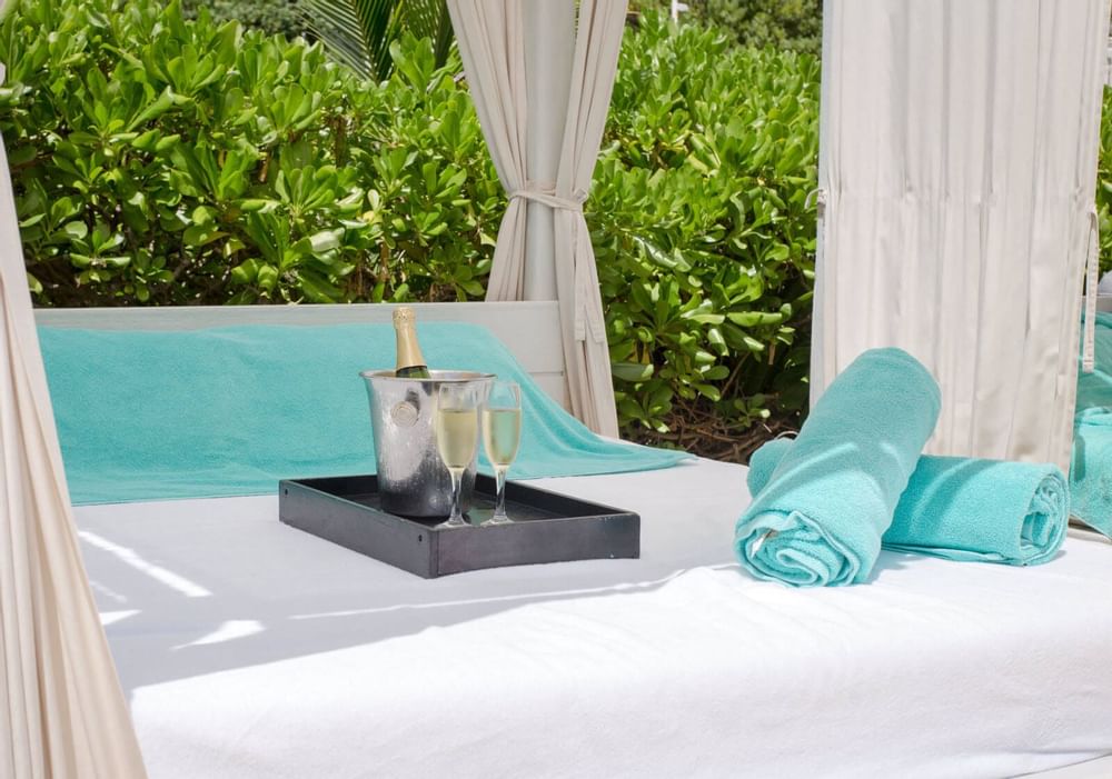 Close-up of champagne & towels on a Cabana at Live Aqua Resorts
