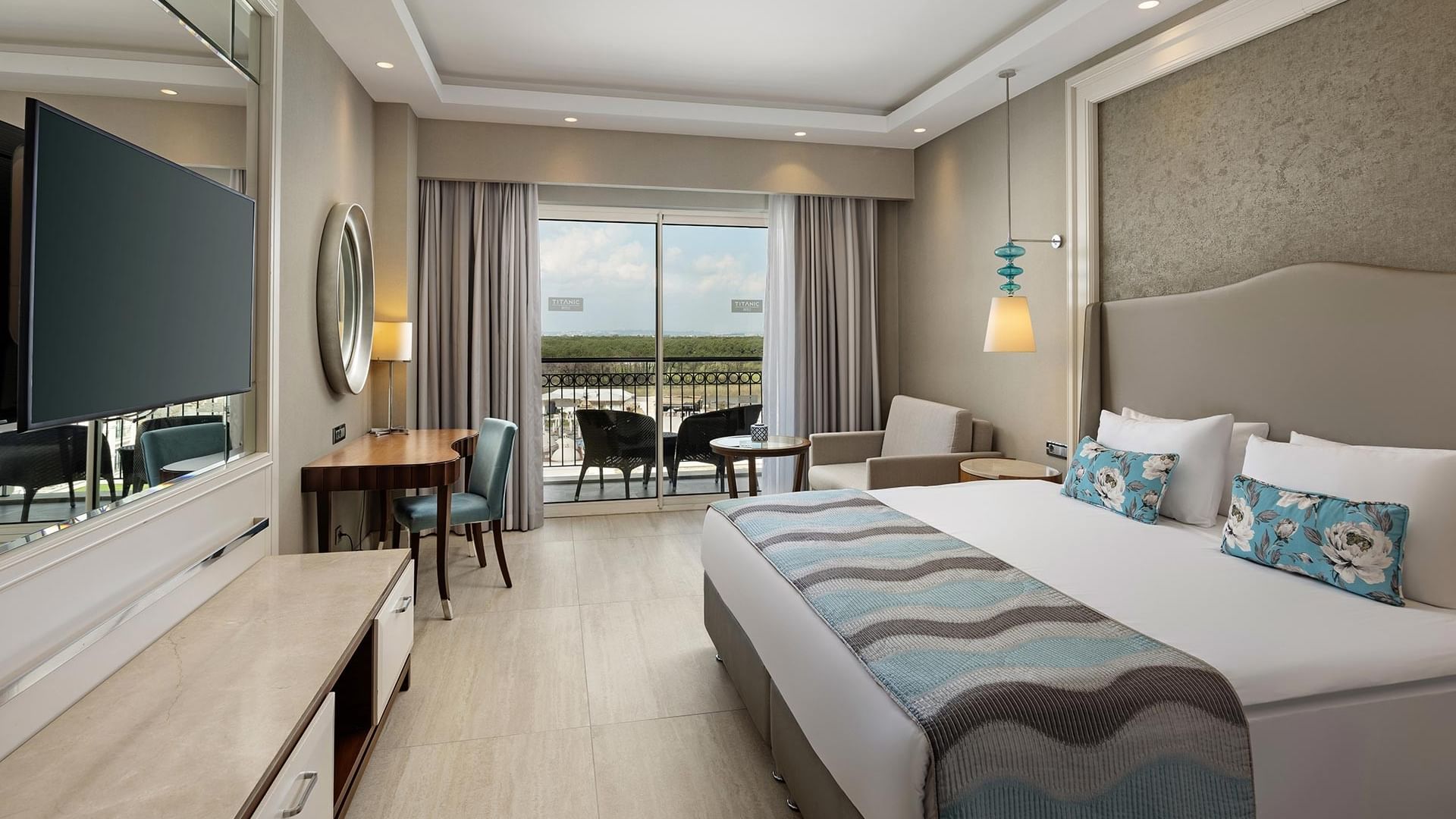 Elegant Standard Room with balcony and modern decor at Titanic Deluxe Golf Belek in Antalya.