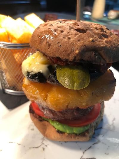 Close-up of a Juicy vegan burger & fries at Orsett Hall Hotel